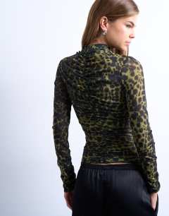 Model wearing Abstract spot print ruched long sleeve top in black