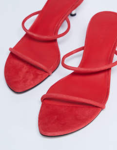 Model wearing Ada suede kitten heel mule in red