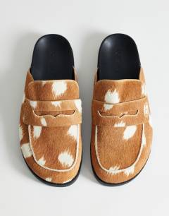 Model wearing Addie hair on real leather mule loafer in large deer print