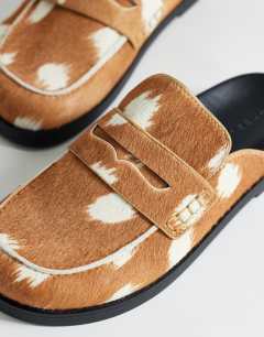 Model wearing Addie hair on real leather mule loafer in large deer print