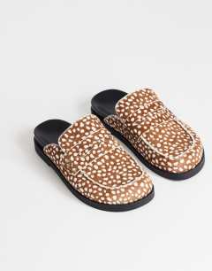 Model wearing Addie hair on real leather mule loafer in mini deer print 