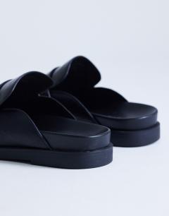 Model wearing Addie loafer mule in black