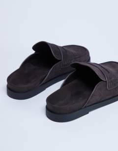 Model wearing Addie real suede mule loafer in chocolate