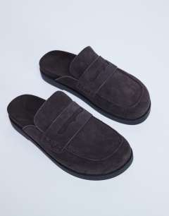 Model wearing Addie real suede mule loafer in chocolate