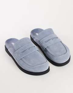 Model wearing Addie real suede mule loafer in cornflower blue
