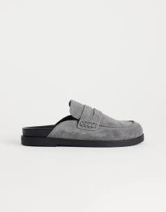 Model wearing Addie real suede mule loafer in grey