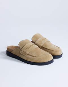 Model wearing Addie real suede mule loafer in taupe