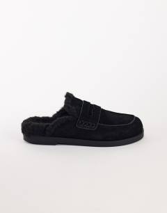 Model wearing Addie real suede mule loafer with shearling in black