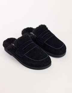 Model wearing Addie real suede mule loafer with shearling in black