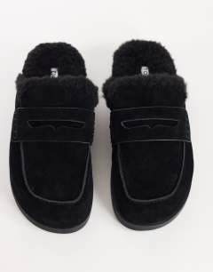 Model wearing Addie real suede mule loafer with shearling in black