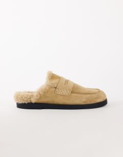 Model wearing Addie real suede mule loafer with shearling in sand