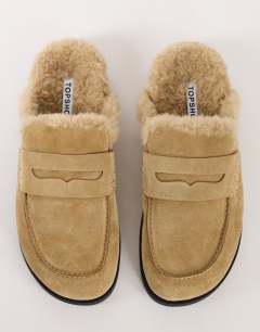 Model wearing Addie real suede mule loafer with shearling in sand