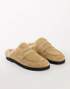 Model wearing Addie real suede mule loafer with shearling in sand
