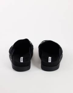 Model wearing Addie real suede studded mule loafer in black