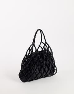 Model wearing Adele small diamond bead grab bag in black