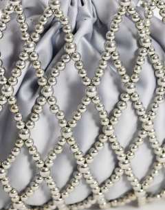 Model wearing Adele small diamond bead grab bag in silver