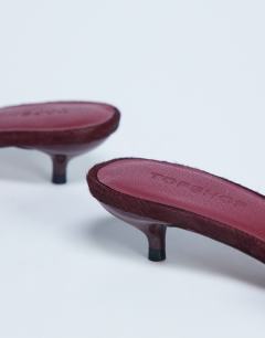 Model wearing Alba peep toe kitten heel mule in red hair on real leather