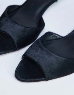 Model wearing Alba real leather peep toe kitten heel mule in black pony
