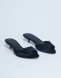 Model wearing Alba real leather peep toe kitten heel mule in black pony