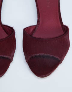 Model wearing Alba real leather peep toe kitten heel mule in red pony