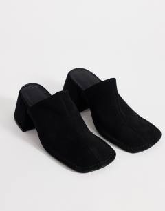 Model wearing Alberto real leather wide block heel mule in black