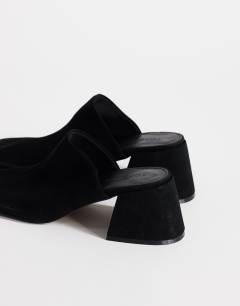Model wearing Alberto real leather wide block heel mule in black