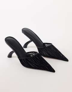Model wearing Alessio angular heel pointed court shoe in black zebra mesh