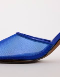 Model wearing Alessio angular heel pointed court shoe in cobalt mesh