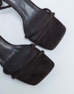 Model wearing Alexa wedge heeled mule in chocolate
