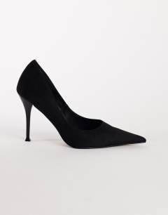 Model wearing Alexander high heel court shoe in black faux suede
