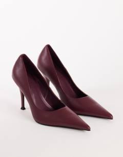 Model wearing Alexander high heel court shoe in burgundy