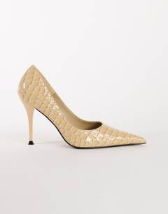 Model wearing Alexander high heel court shoe in off white croc