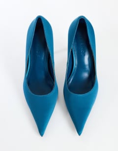Model wearing Alexander high heel court shoe in teal satin