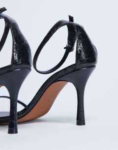 Model wearing Alexi 2 part heeled sandal in black