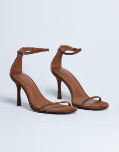 Model wearing Alexi real suede 2 part heeled sandal in camel