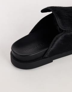 Model wearing Alexia long hair on real leather loafer mule in black