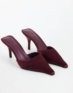 Model wearing Alfie pointed heeled court in aubergine satin