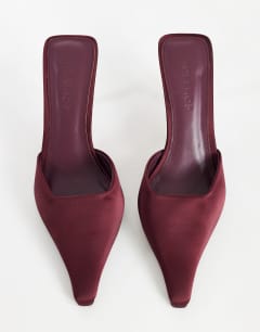 Model wearing Alfie pointed heeled court in aubergine satin