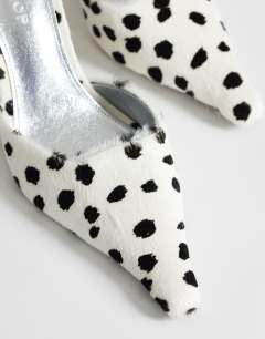Model wearing Alfie real hair on leather pointed heeled court in dalmatian