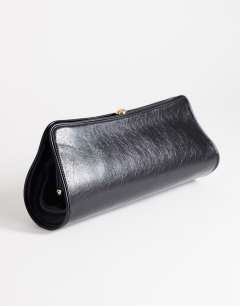 Model wearing Alice medium clutch bag in black