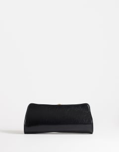 Model wearing Alice medium clutch bag in black