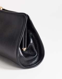Model wearing Alice medium clutch bag in black