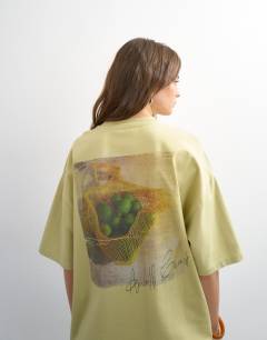 Model wearing Amalfi embroidered graphic oversized tee in lime green