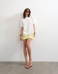 Model wearing Amalfi graphic tee in ecru