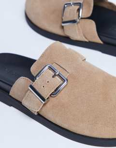 Model wearing Amy slip on mule with buckle in beige hair on real leather