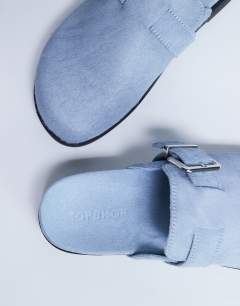 Model wearing Amy slip on mule with buckle in light blue hair on real leather 