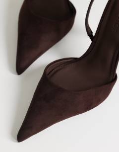 Model wearing Angel faux suede heeled court shoe in chocolate