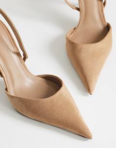 Model wearing Angel faux suede heeled court shoe in taupe