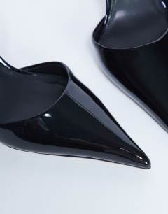 Model wearing Angel heeled court shoe in black patent