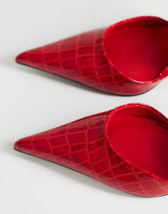 Model wearing Angel heeled court shoe in patent red croc